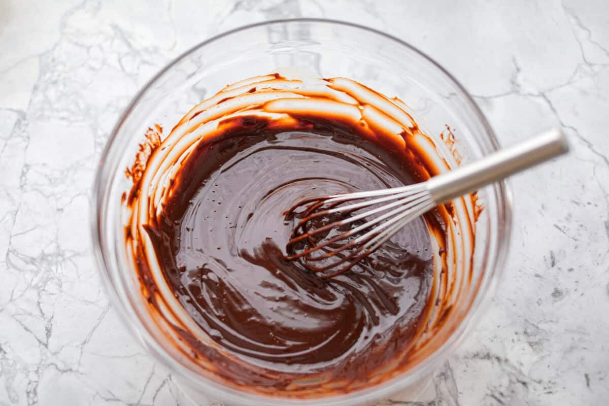 Overhead shot of the melted chocolate chips whisked together with the cream and Guinness. 