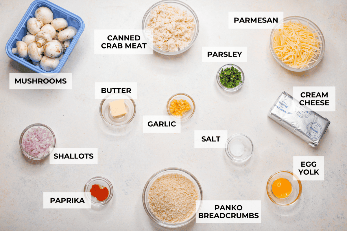 These Crab Stuffed Mushrooms are a deliciously savory appetizer, perfect for impressing guests at any gathering. With a rich crab filling in every bite, they’re sure to be a crowd favorite! Overhead shot of labeled ingredients.