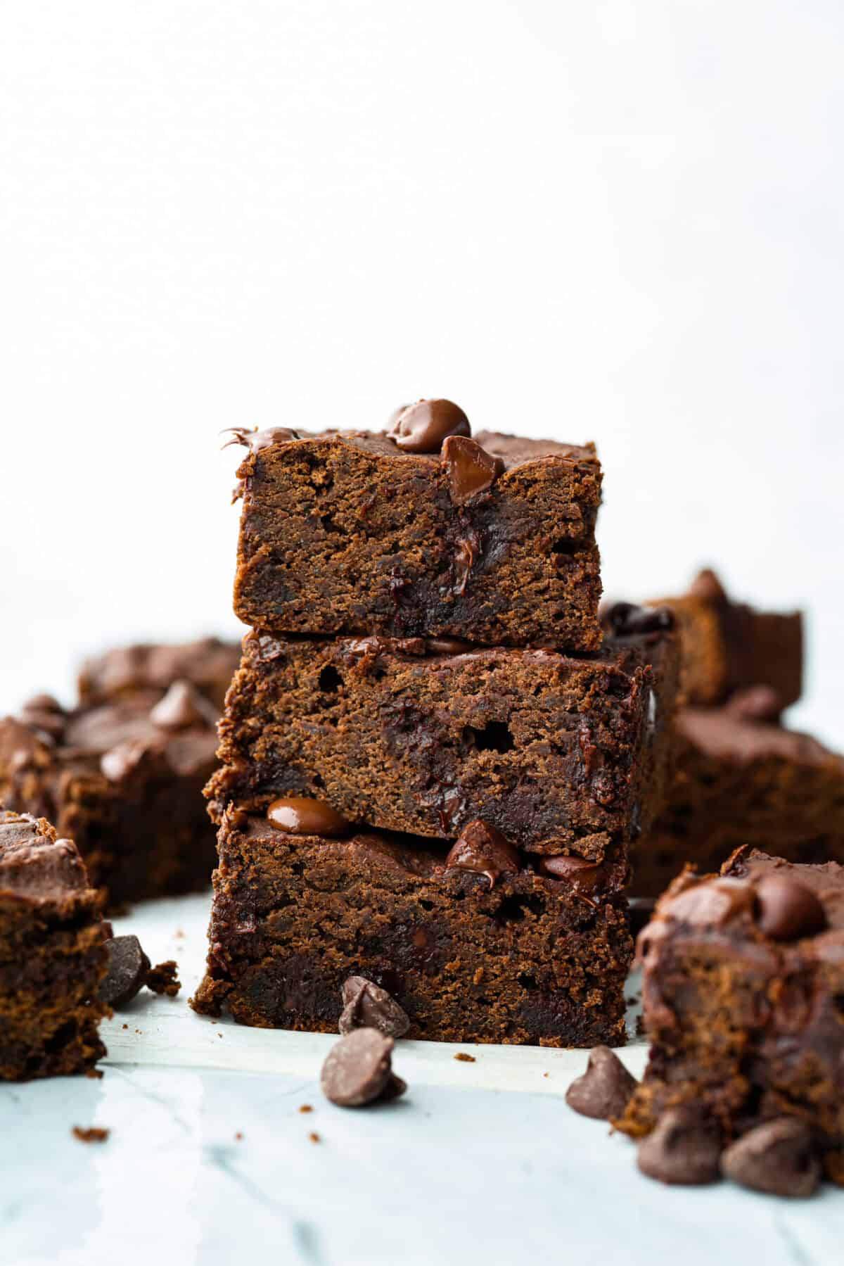 Side shot of stacked black bean brownies. 