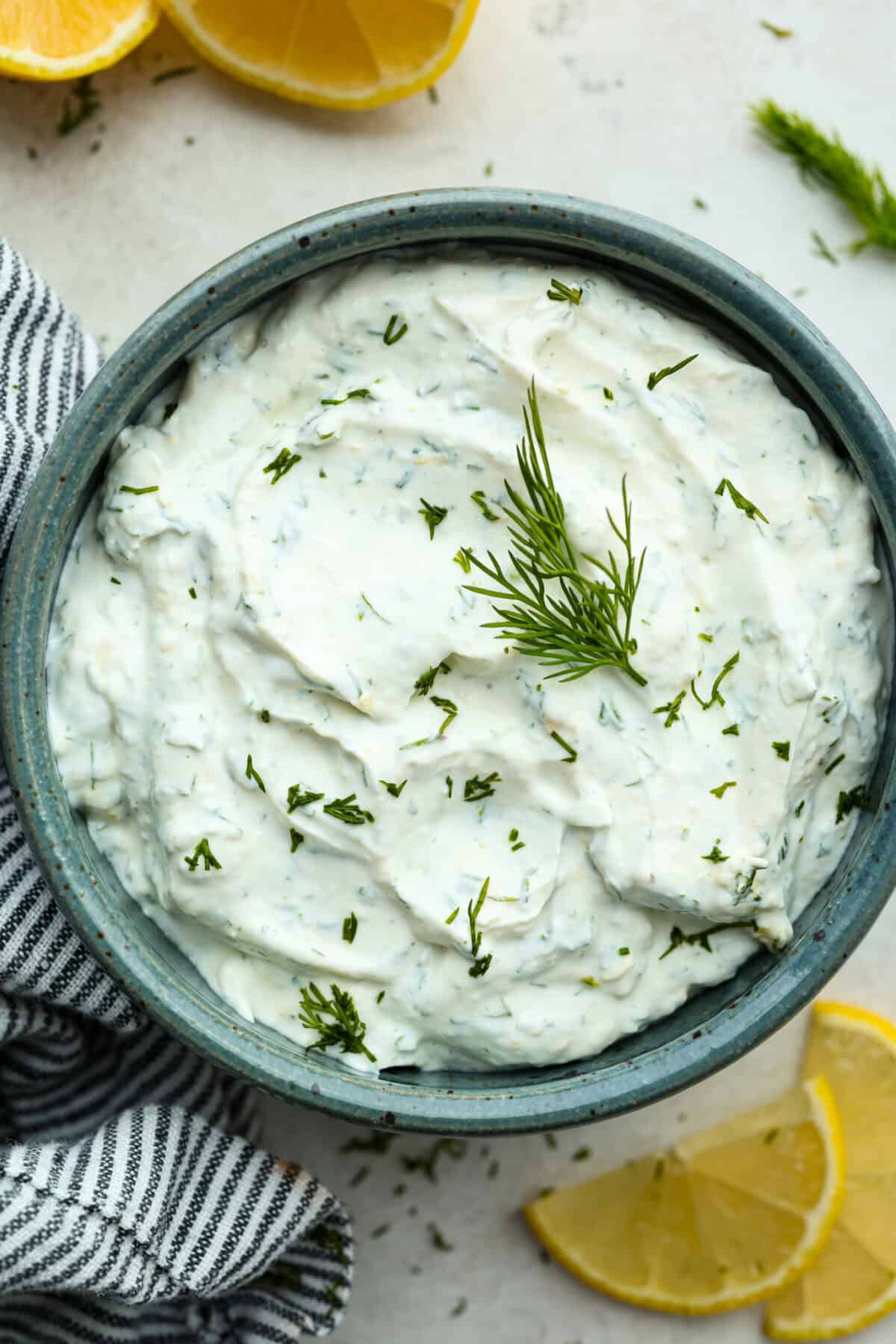 Overhead shot of a bowl of lemon dill sauce. 