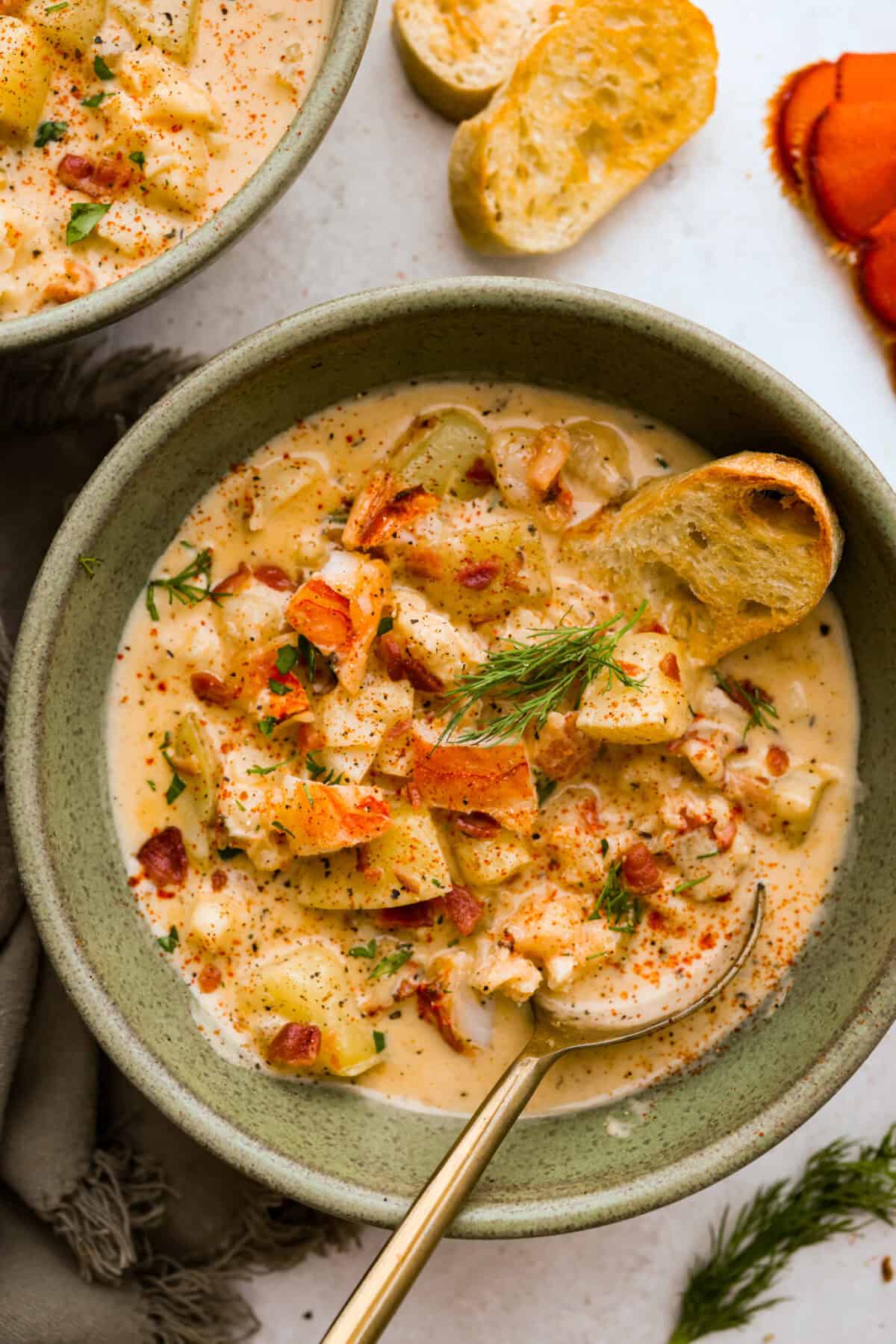 Overhead shot of a bowl of lobster chowder. 