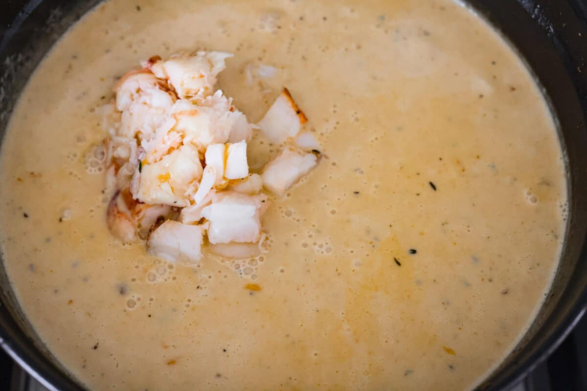 Overhead shot of the lobster on top of the soup. 