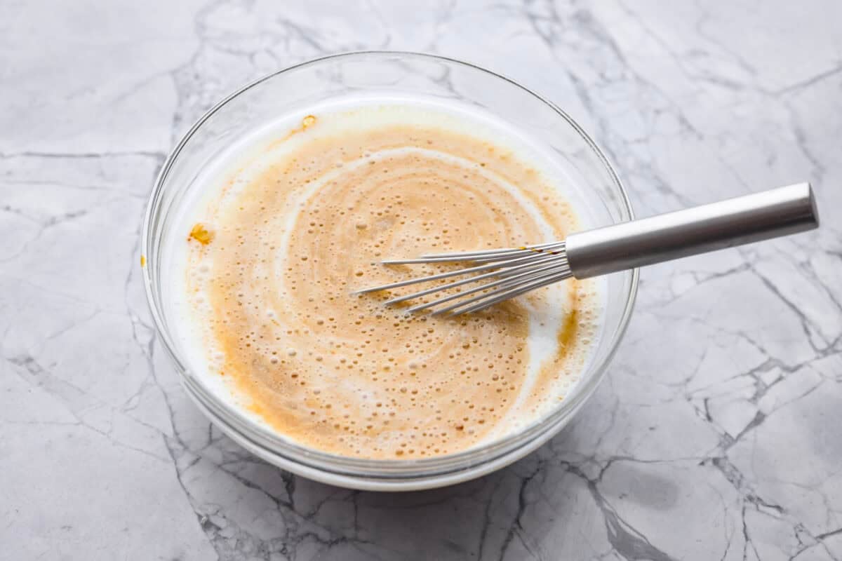 Overhead shot of all of the wet ingredients in a bowl. 