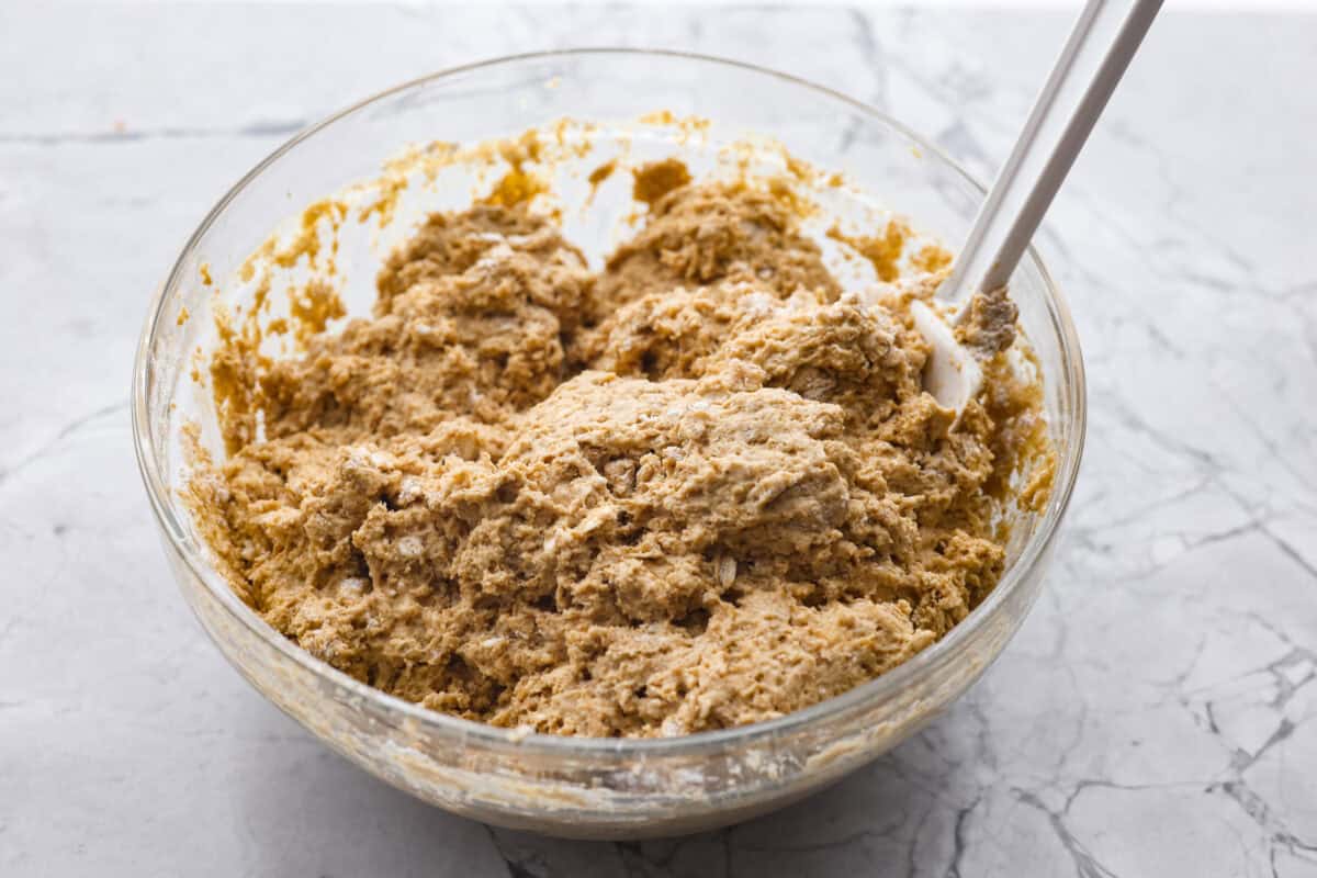 Angle shot of both the dry and wet ingredients mixed together in a bowl. 