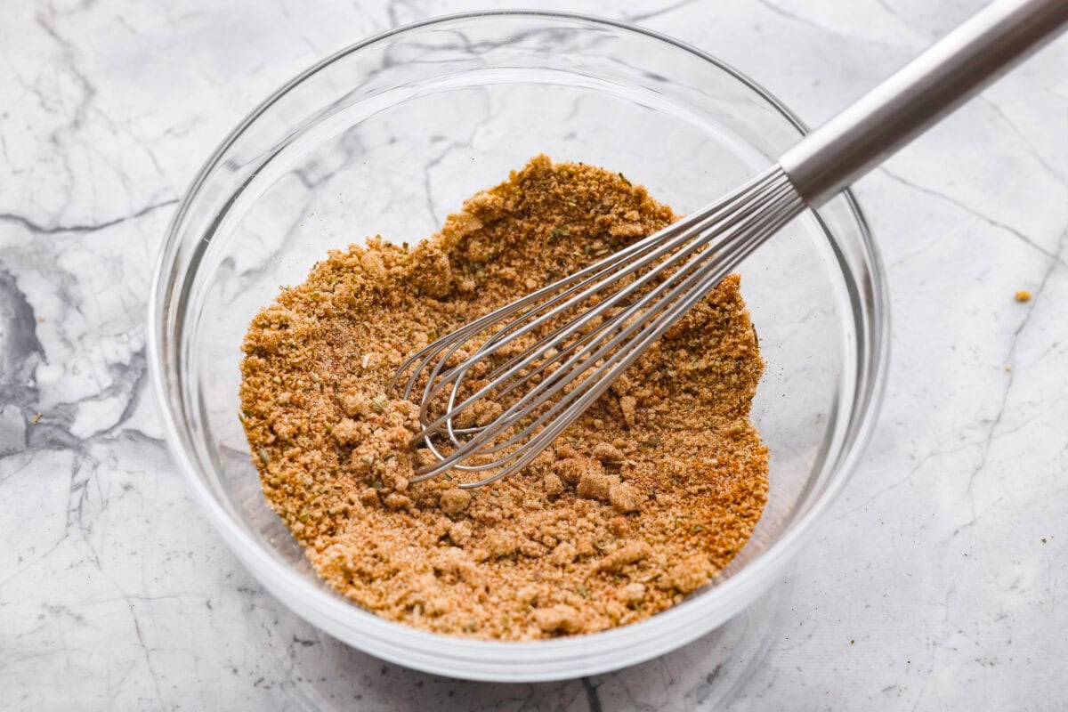 Brown sugar and seasonings whisked together in a bowl. 