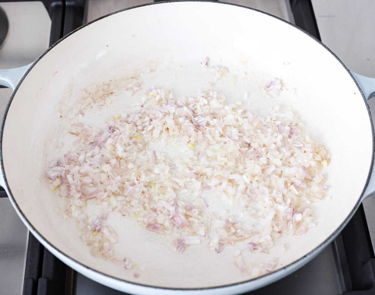 Fresh lemons make me so happy! They’re bright, cheerful, and lift me out of the winter rut. Add that citrusy sunshine to a creamy pasta, and you get this dreamy Creamy Lemon Orzo! Simple, rich, and bursting with feel-good flavor. Shallots and butter cooking in a skillet.