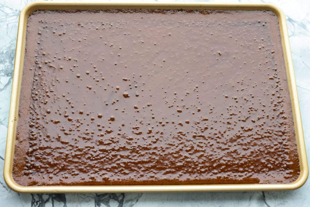 Dr. Pepper Texas Sheet Cake is what happens when your favorite fizzy drink meets rich, fudgy chocolate cake, and it’s magic! The Dr. Pepper deepens the sweetness and gives the cake this warm, almost cherry-fudge vibe that’s totally irresistible. Cake batter poured into a sheet pan.