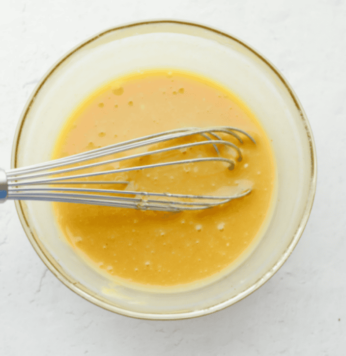 All of the ingredients whisked together in a bowl.