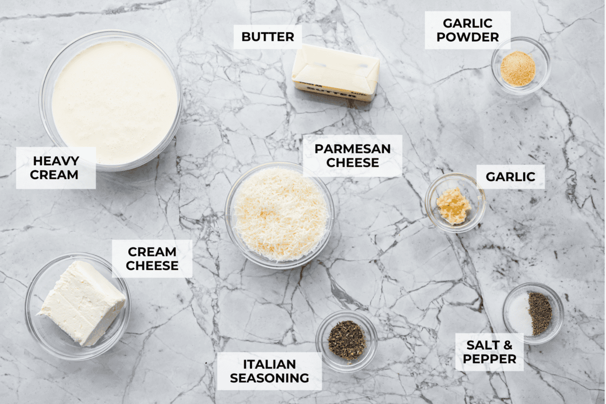 Alfredo sauce is one of my most popular recipes EVER! The secret is a little cream cheese, and ohhh my gosh, the tangy creaminess takes it to the next level. You and your kids will inhale it, I promise! Overhead shot of labeled ingredients.