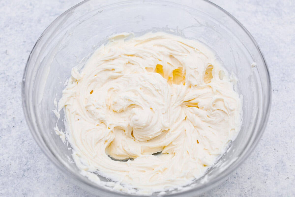 My Dad LOVES coconut cream pie! When I don't have it in me to make a pie, I make this easy Coconut Lush dessert! It’s rich, dreamy, and always the first dessert to disappear at family gatherings. Cream cheese whipped and mixed.