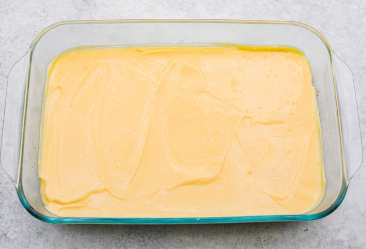 My Dad LOVES coconut cream pie! When I don't have it in me to make a pie, I make this easy Coconut Lush dessert! It’s rich, dreamy, and always the first dessert to disappear at family gatherings. Pudding spread on top of the cream cheese layer.