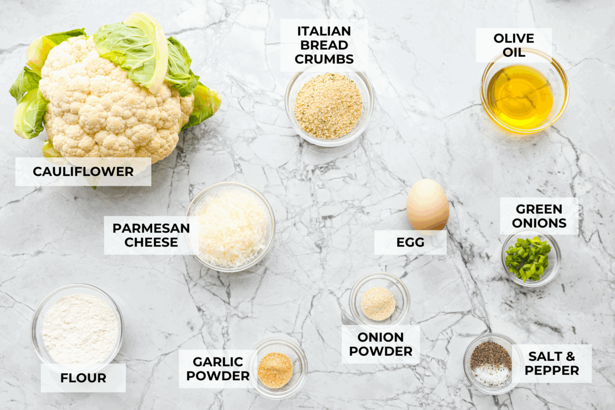 These crispy cauliflower fritters are how I trick my kids into eating veggies. They even ask for seconds. The parmesan and savory seasonings make these golden, cheesy, and packed with flavor! Overhead shot of labeled ingredients.