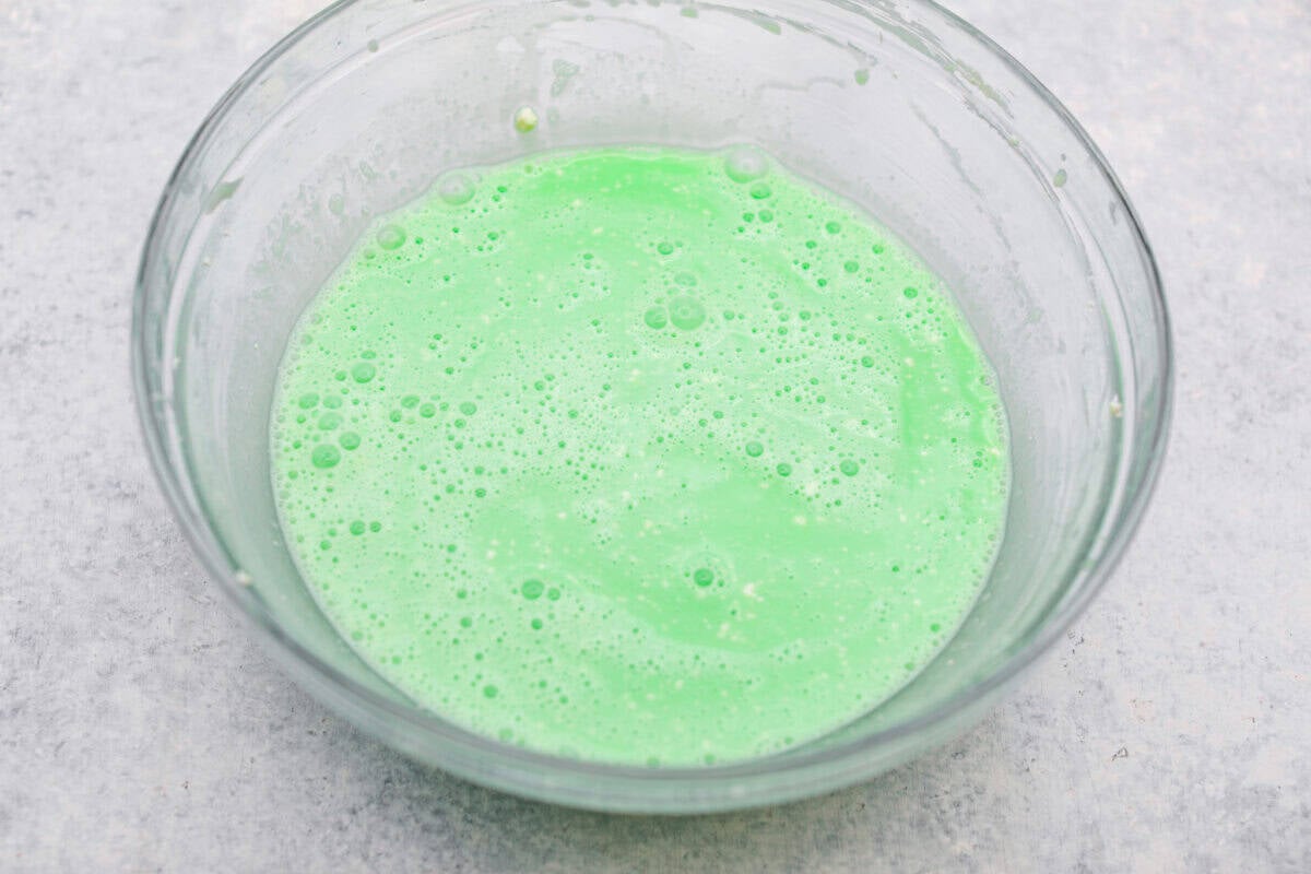 I gave the vintage lime Jello salad a modern makeover. With cream cheese for tang, pineapple and lime for zip, and a splash of 7-Up for that light, fizzy fluff, this retro-inspired treat is now a sweet, citrusy dream I know you guys will love! Cooled Jello added to the cream cheese.
