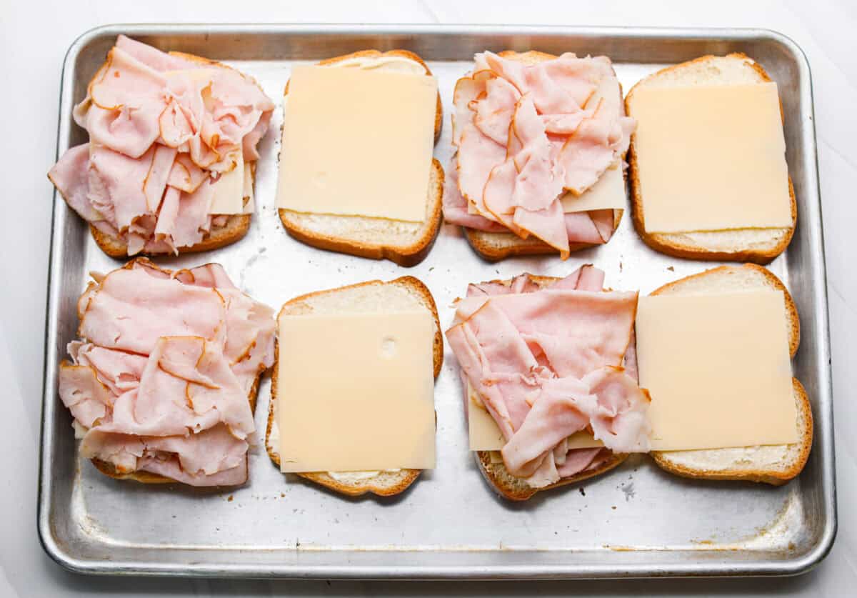 Turkey added to the top of the cheese and ham. 
