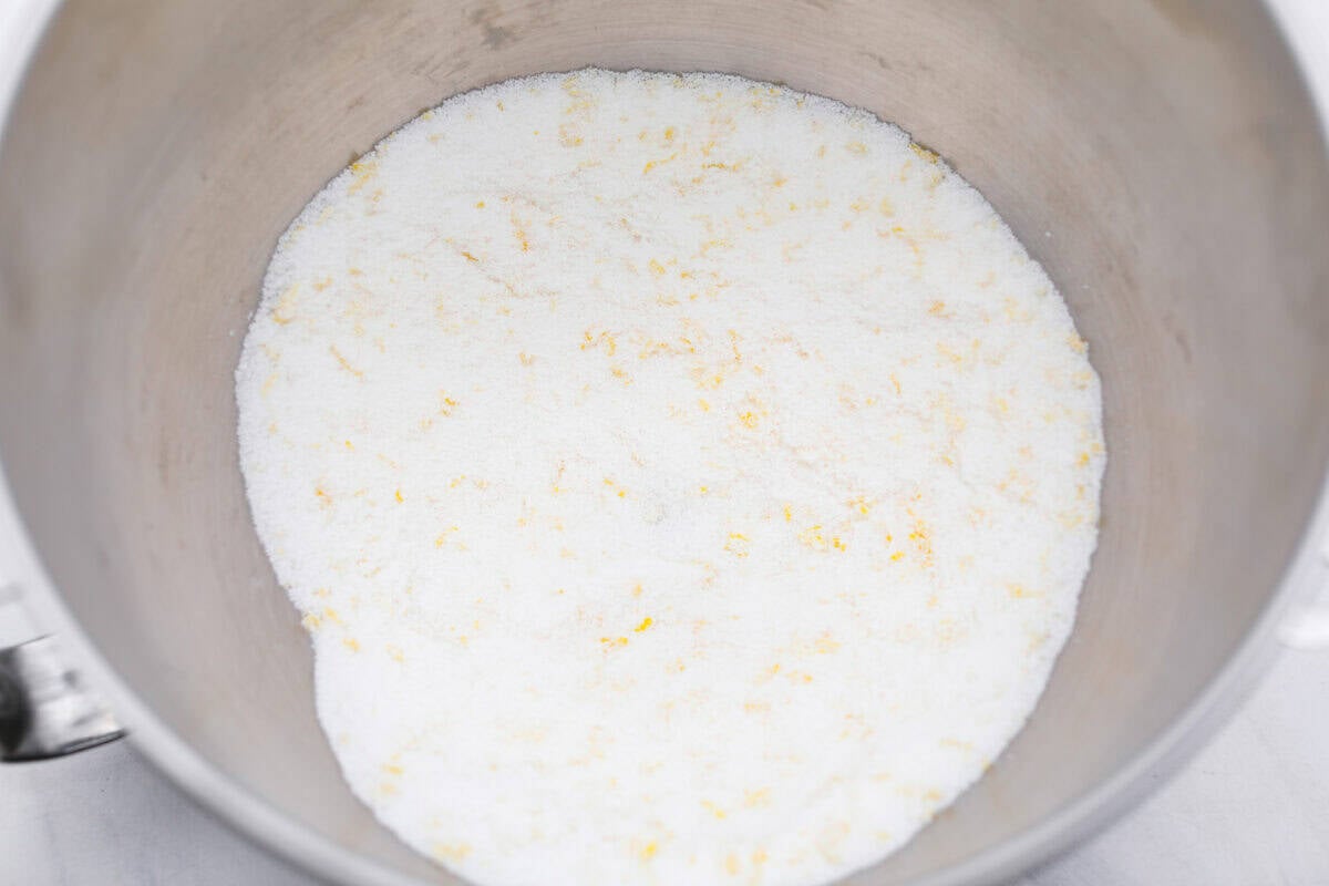 Sugar mixed with lemon zest in a bowl. 