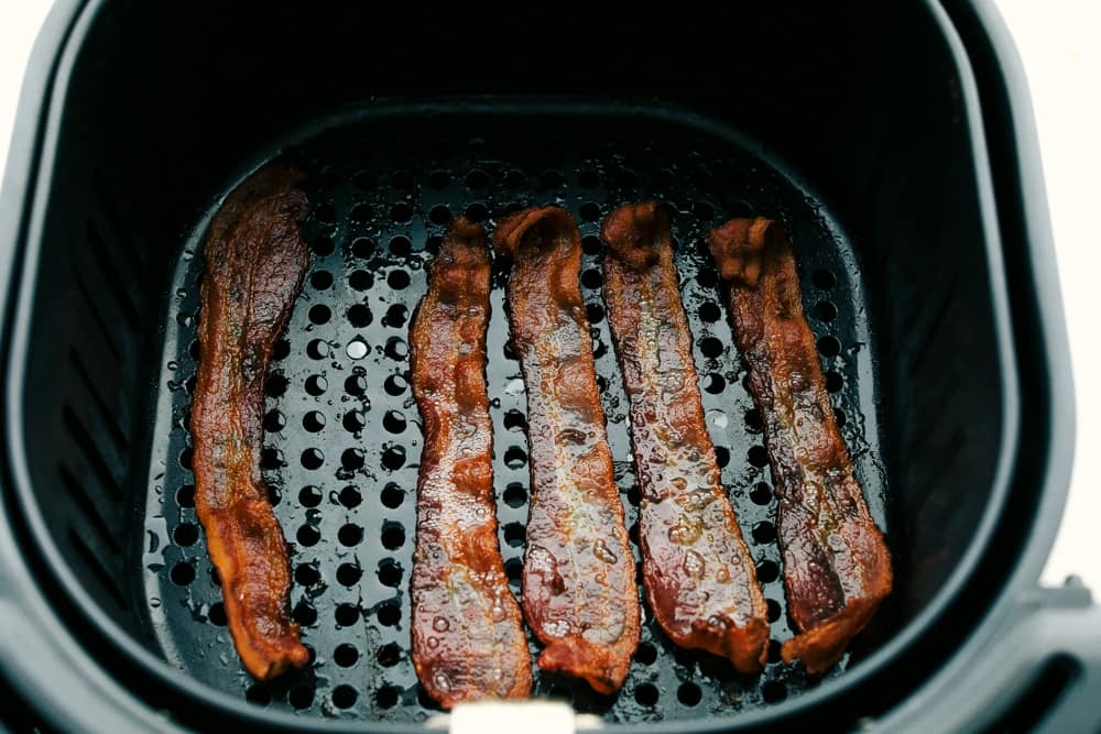 Overhead shot of cooked bacon at the bottom of the basket. 