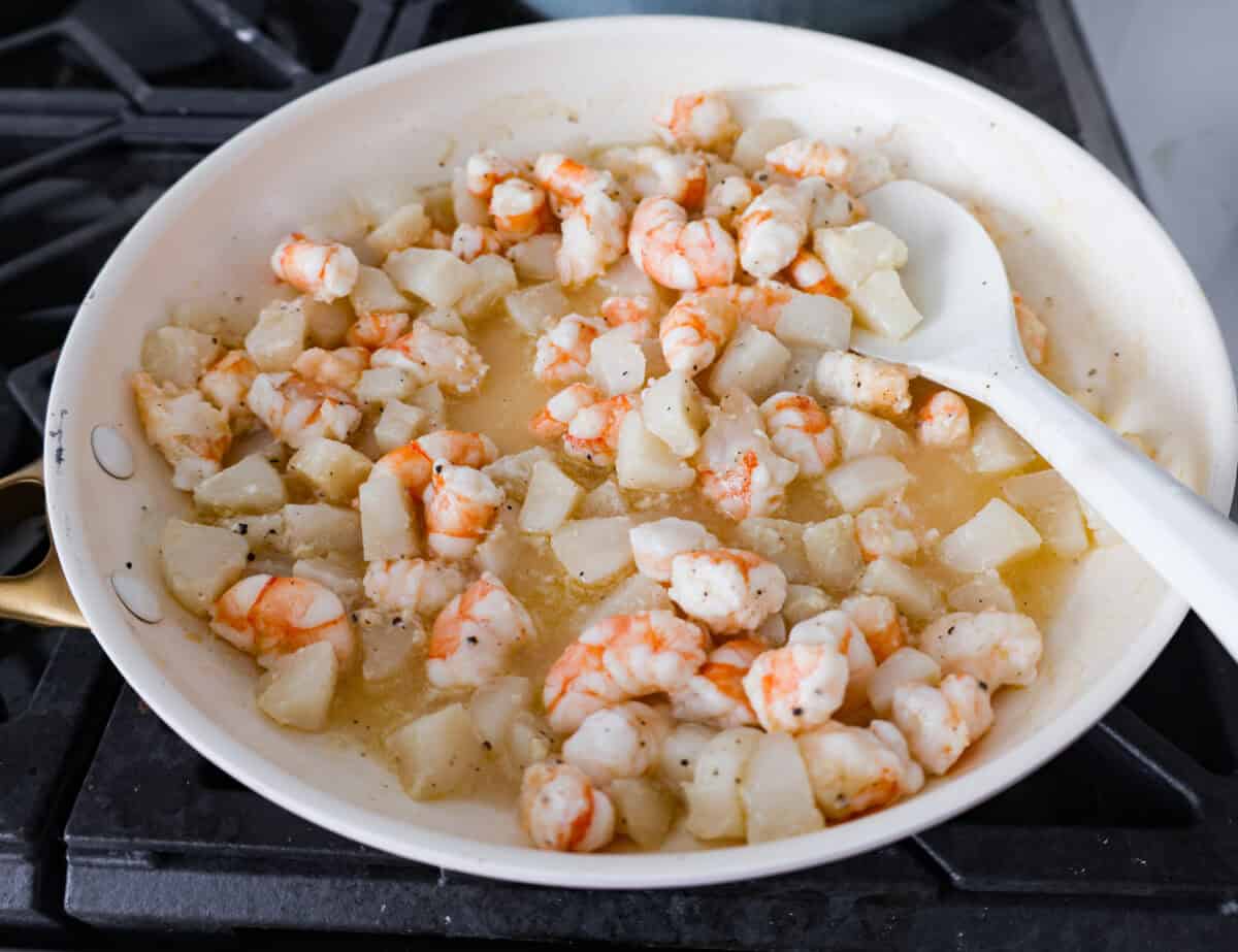 If you’re a seafood lover, you'll be obsessed with this Seafood Lasagna. I’m talking crab, scallops, and shrimp in creamy, cheesy layers, baked to bubbly perfection. It’s my go-to dinner when I’m cooking for seafood fans! Seafood cooking in a skillet.