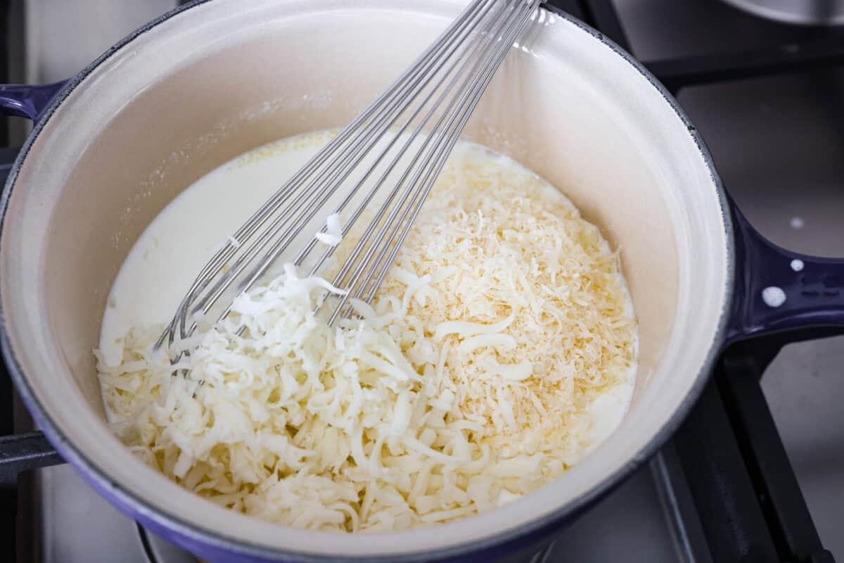 Craving something cozy, cheesy, and totally irresistible? My four cheese pasta brings comfort with a creamy ricotta base and a melty mix of easy-to-find Italian cheeses. It’s indulgent and totally hits the flavor jackpot! Cheese stirred in to the cream base.