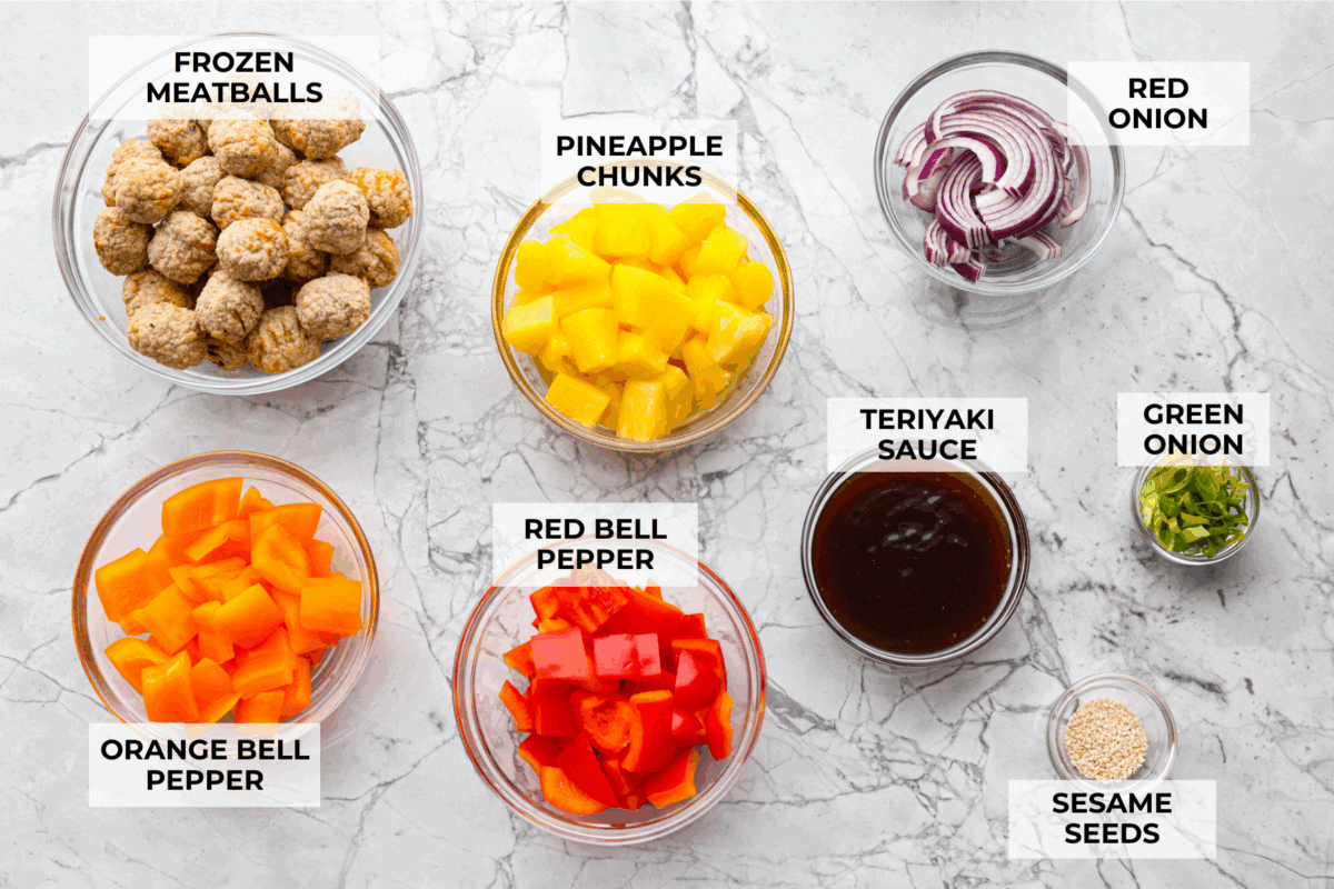 These meatball foil packets have juicy meatballs, sweet pineapple, colorful veggies, covered in sticky teriyaki sauce, and grilled to perfection. Easy to make, fun to eat, and no dishes to wash! Yes, please! Overhead shot of labeled ingredients.