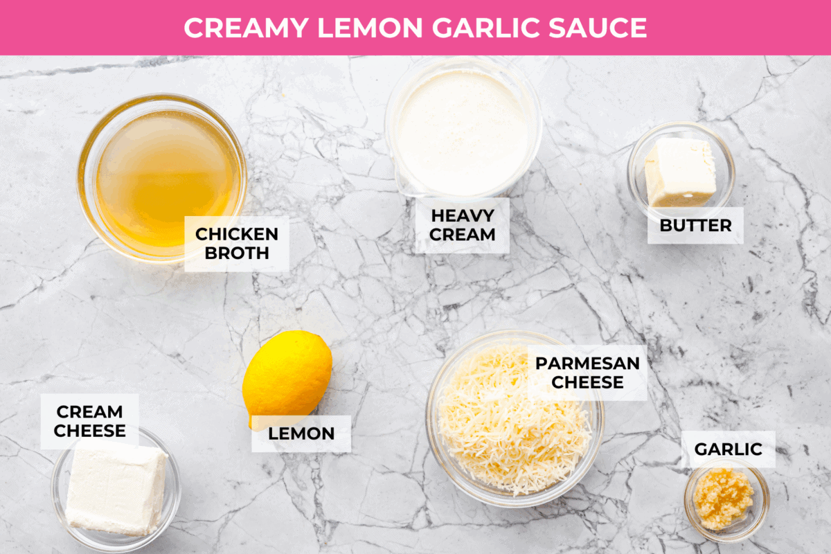 My seafood pasta has a silky lemon garlic cream sauce that is to die for! It's loaded with tender shrimp, scallops, and mussels. It’s the perfect date night dish! Overhead shot of labeled sauce ingredients.