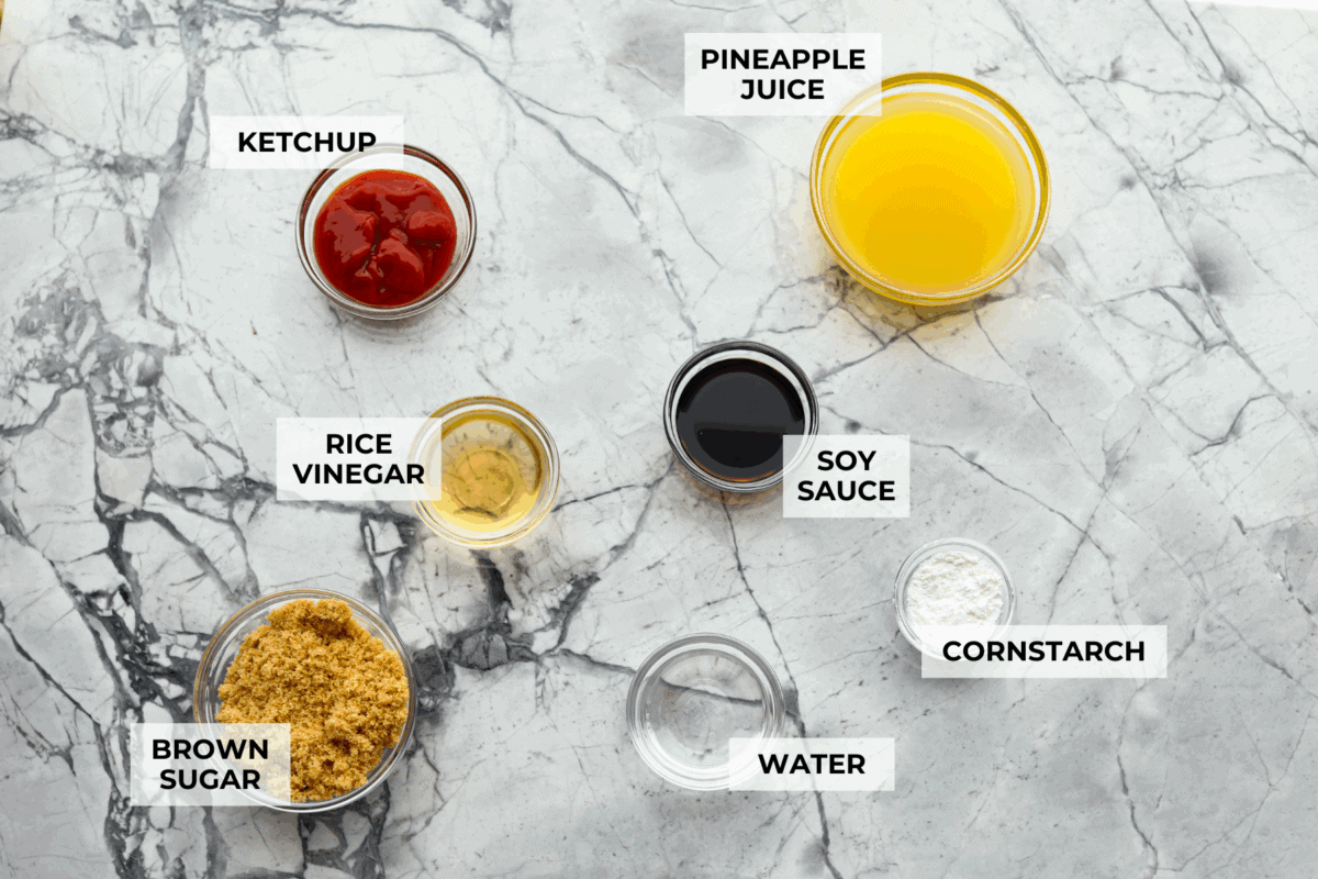 I’ve tested a lot of sweet and sour sauces, and this is the one I always come back to. My recipe uses pineapple juice for that perfect tangy-sweet balance, and it’s ready in minutes with pantry staples. Overhead shot of labeled sweet and sour sauce ingredients.