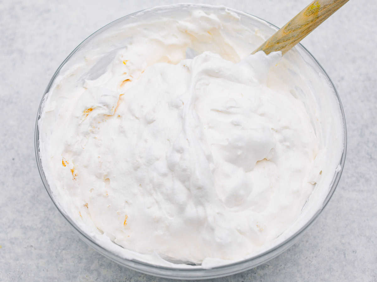 Craving a bright and sunny dessert? This pineapple delight will hit the spot! With a buttery crust, creamy filling, and sweet pineapple topping, it’s light, tropical, and totally irresistible! Pineapple added to the whipped topping.