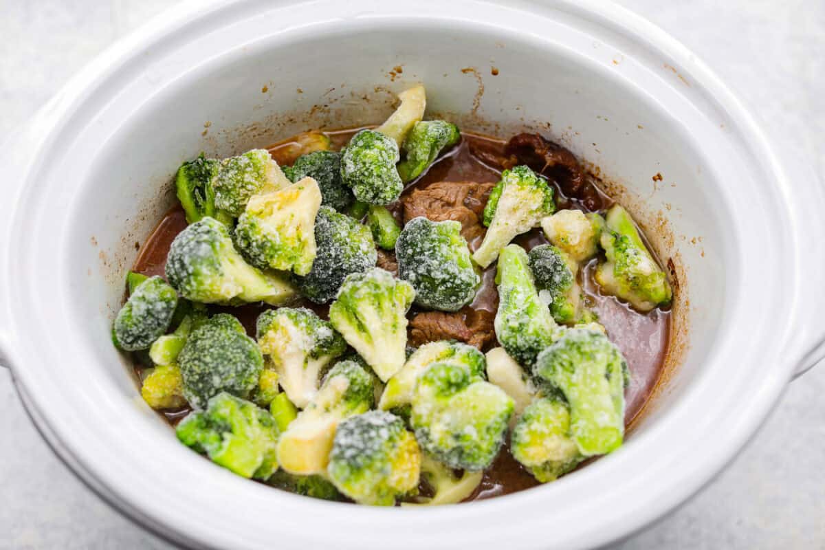 Frozen broccoli added to the slow cooker. 