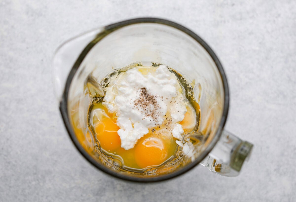 I’ve been hooked on Starbucks egg bites for years, but not the price! This homemade version is just as fluffy and flavorful, and makes the perfect grab-and-go, protein-packed breakfast. Eggs, cottage cheese, and seasonings in a blender.