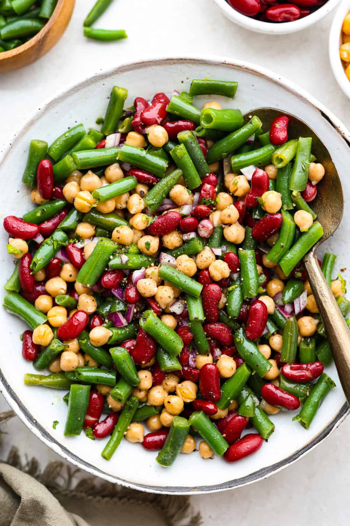 Vibrant image of classic three bean salad in a serving platter. 