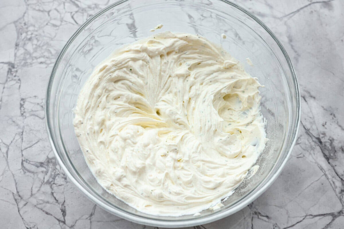 Creamy, cheesy, and loaded with crack dip flavor! This 6-ingredient appetizer is served cold and ready in just 10 minutes. Good luck keeping it on the table. Cream cheese, sour cream, and ranch dressing mix all whipped together in a bowl.