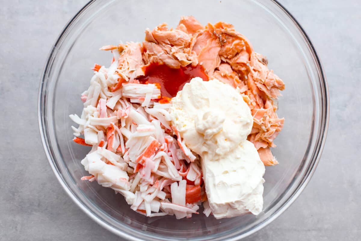 All of the fish and cream cheese combined and sauce combined together in a bowl. 