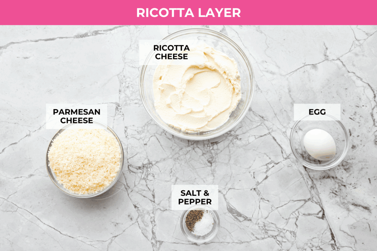 They don’t call it Marry Me Lasagna for nothing! One bite of the creamy sauce, tender chicken, and melty cheese, and everyone will be saying, "YES!" Overhead shot of labeled ricotta layer ingredients.