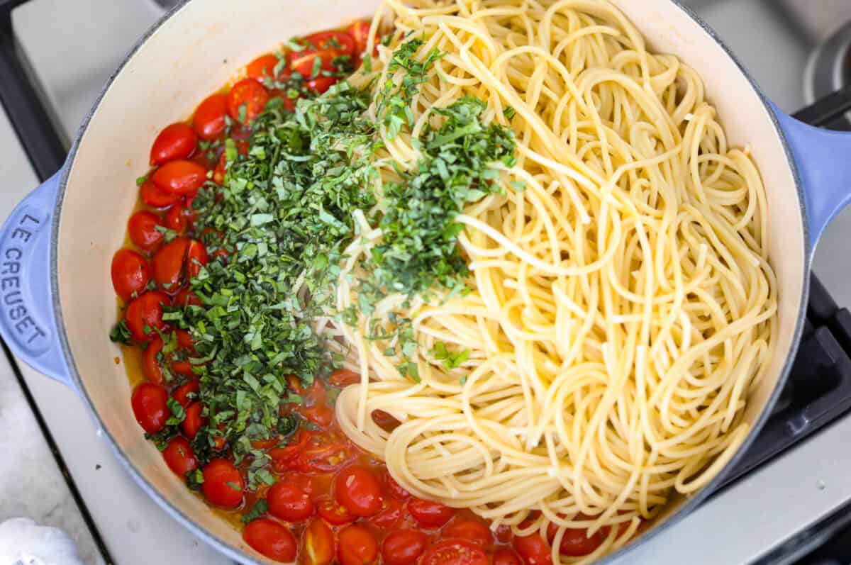 Spaghetti Margherita has been a family favorite since I was a kid, though we just called it “pasta with tomato and basil.” It’s simple, fresh, and so full of flavor, even my meat-loving husband can’t get enough! Cooked pasta, and fresh basil added to the skillet with the tomatoes.