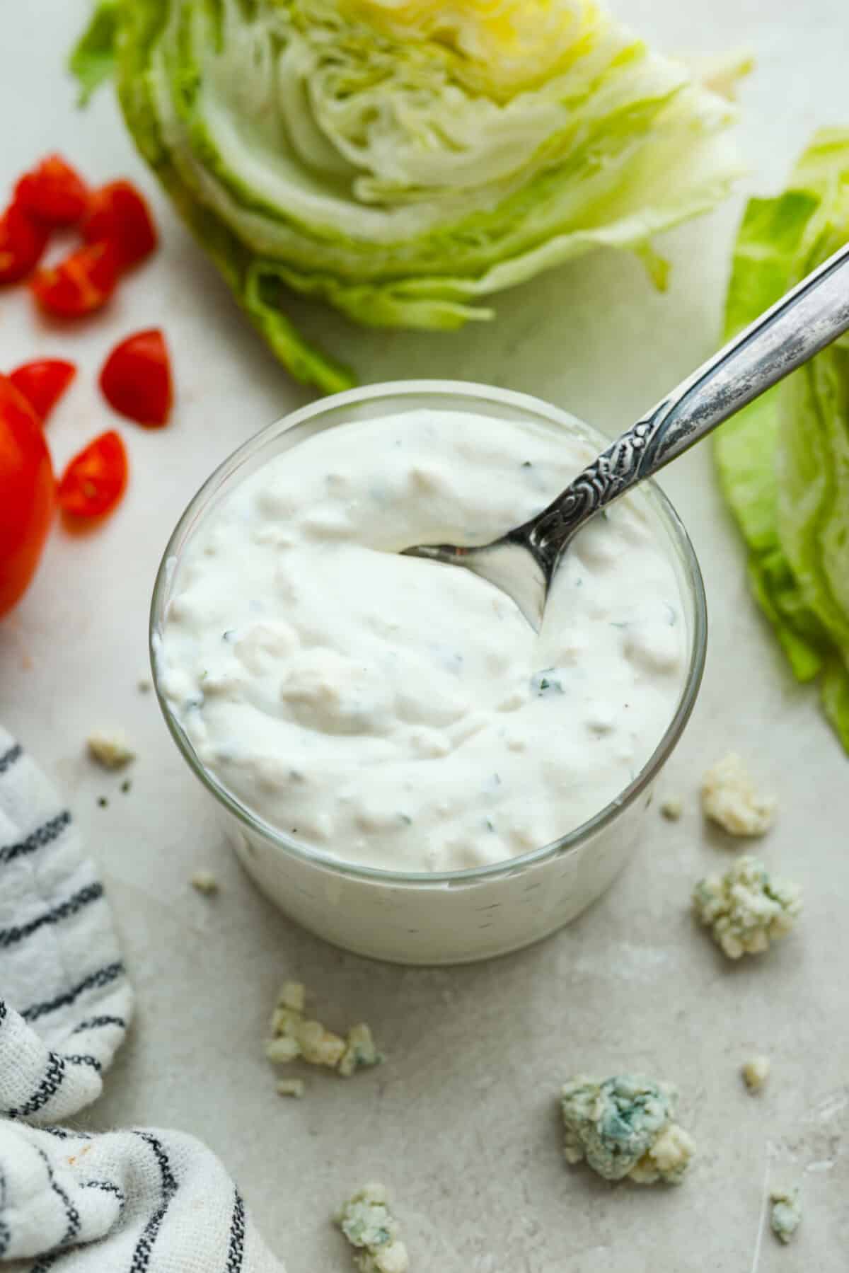 Once you try this homemade blue cheese dressing, thereโs no going back to store-bought! Itโs the perfect cool and creamy drizzle for wings, salads, and more. Overhead shot of a small jar of homemade blue cheese dressing.