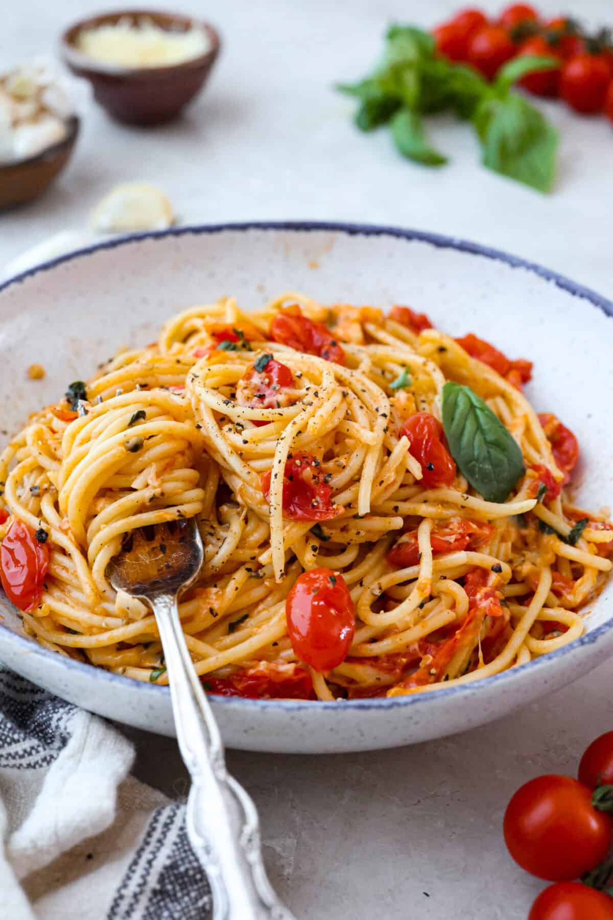 Spaghetti Margherita has been a family favorite since I was a kid, though we just called it “pasta with tomato and basil.” It’s simple, fresh, and so full of flavor, even my meat-loving husband can’t get enough! Plate of spaghetti margherita with a fork.