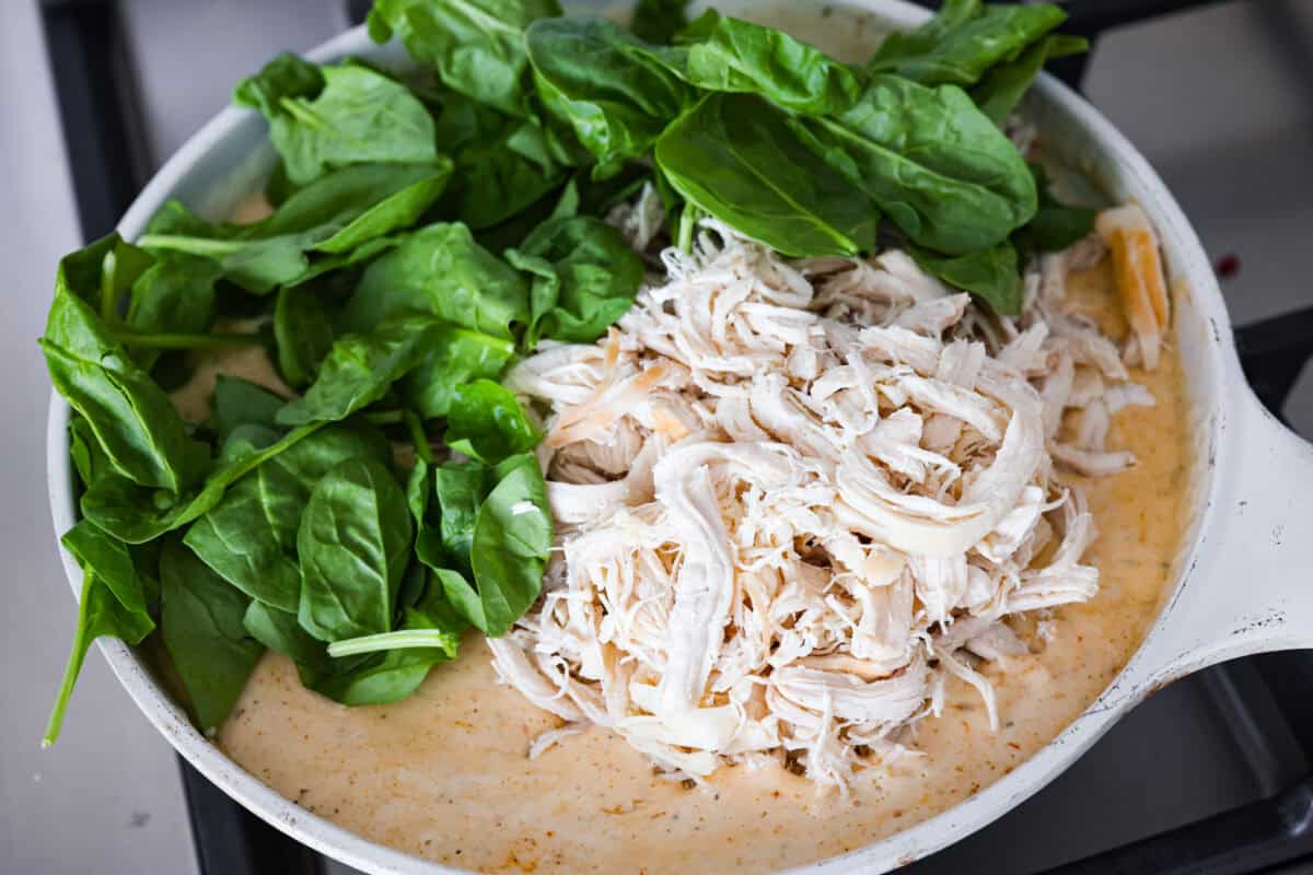 They don’t call it Marry Me Lasagna for nothing! One bite of the creamy sauce, tender chicken, and melty cheese, and everyone will be saying, "YES!" Chicken and spinach added to the marry me lasagna sauce.