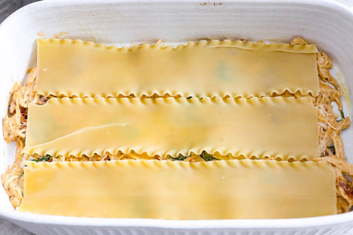 They don’t call it Marry Me Lasagna for nothing! One bite of the creamy sauce, tender chicken, and melty cheese, and everyone will be saying, "YES!" Bottom layer of meat sauce with lasagna noodles on top.