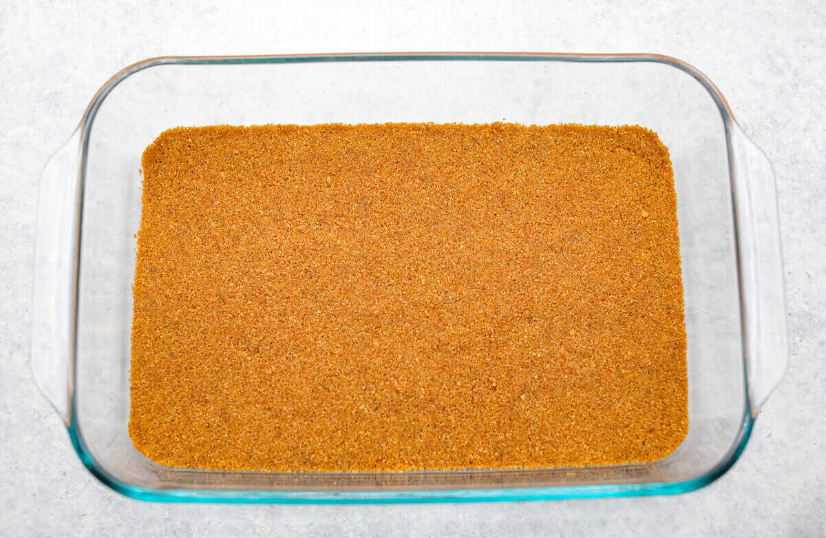 Caramel Apple Pie Lush is the easiest fall dessert you’ll ever make! With layers of buttery crust, creamy cheesecake, spiced apples, caramel, and whipped topping, it’s a yummy fall treat that is so much easier than baking a pie from scratch! Graham cracker crumb mixture smashed into the bottom of the pan for the crust.
