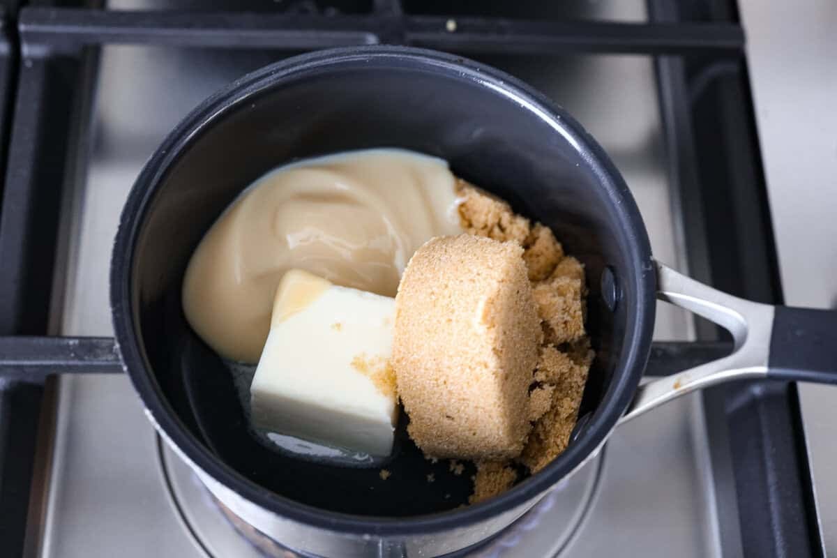 These Caramel Apple Cinnamon Rolls are soft, gooey, and baked with cozy fall flavor in every bite. The homemade dough bakes up perfectly fluffy, and the rich caramel topping makes them feel extra special. Sweetened condensed milk, sugar, and butter in a saucepan.