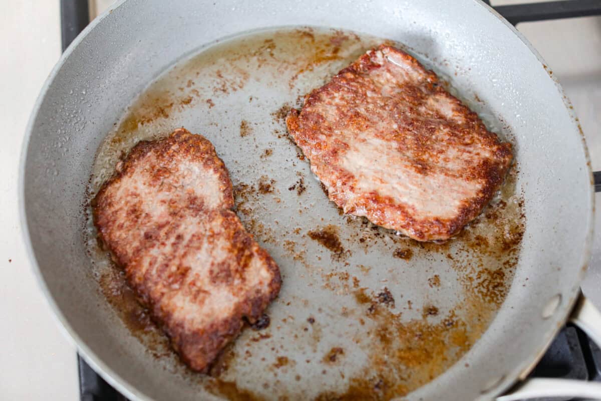 Cube steaks are my go-to budget comfort food. They're quick, cozy, and smothered in gravy. I love them with mashed potatoes or veggies, and I’ve got a simple trick to keep them melt-in-your-mouth tender every time. Cube steaks pan frying in a skillet.