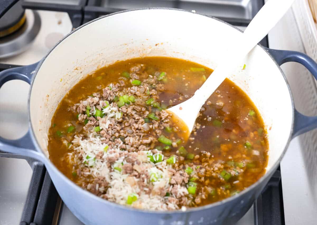 Why is it called “dirty” rice? The rice gets brown as it cooks with meat, Cajun spices, and the holy trinity of Cajun cooking: onion, bell pepper, and celery. My version combines ground pork and beef for a flavorful twist on this Louisiana classic! Broth and rice added to the meat and veggie mixture.