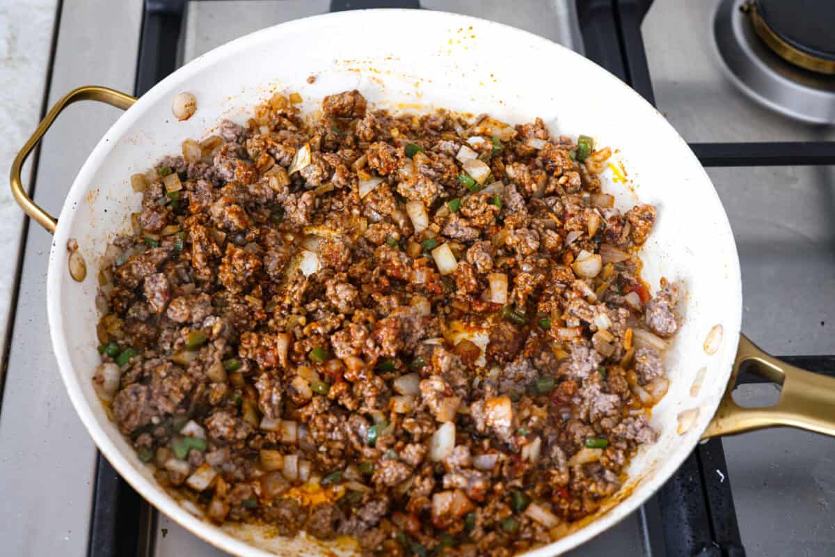Cooked beef with seasonings added.