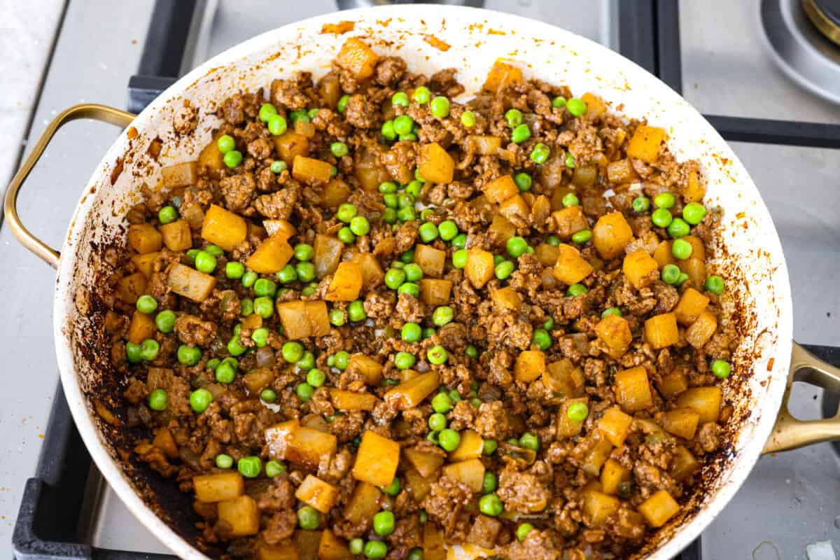 Peas added to the beef and potato mixture.