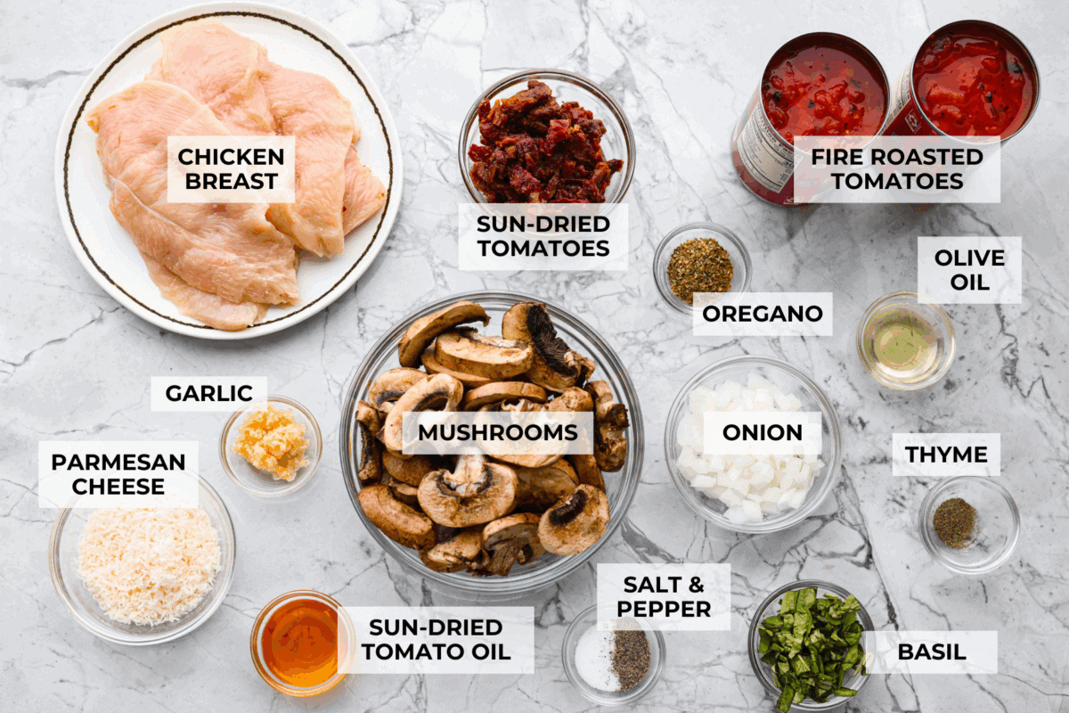 Tuscan garlic skillet chicken is one of those dinners I make and then wonder why I don’t make it more often. Juicy chicken and sun-dried tomatoes all cook together in one skillet. No heavy cream needed. Just fresh, bold flavor in 30 minutes! Overhead shot of labeled ingredients.