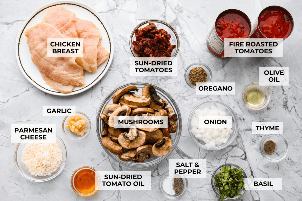 Tuscan garlic skillet chicken is one of those dinners I make and then wonder why I don’t make it more often. Juicy chicken and sun-dried tomatoes all cook together in one skillet. No heavy cream needed. Just fresh, bold flavor in 30 minutes! Overhead shot of labeled ingredients.