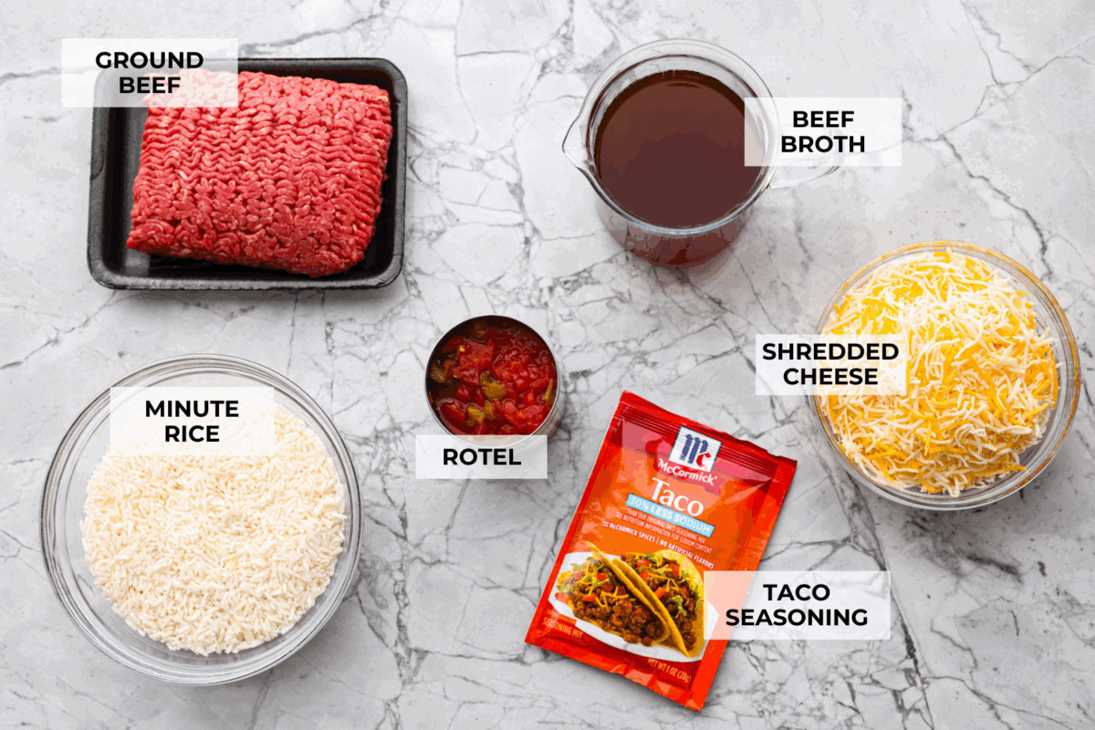 This is about to change your taco game forever! No shell needed! This dump-and-go taco rice is so easy and made with just 6 ingredients. Throw it together, top it your way, and boom, you’ve got a totally unique and delicious taco night! Overhead shot of labeled taco rice ingredients.
