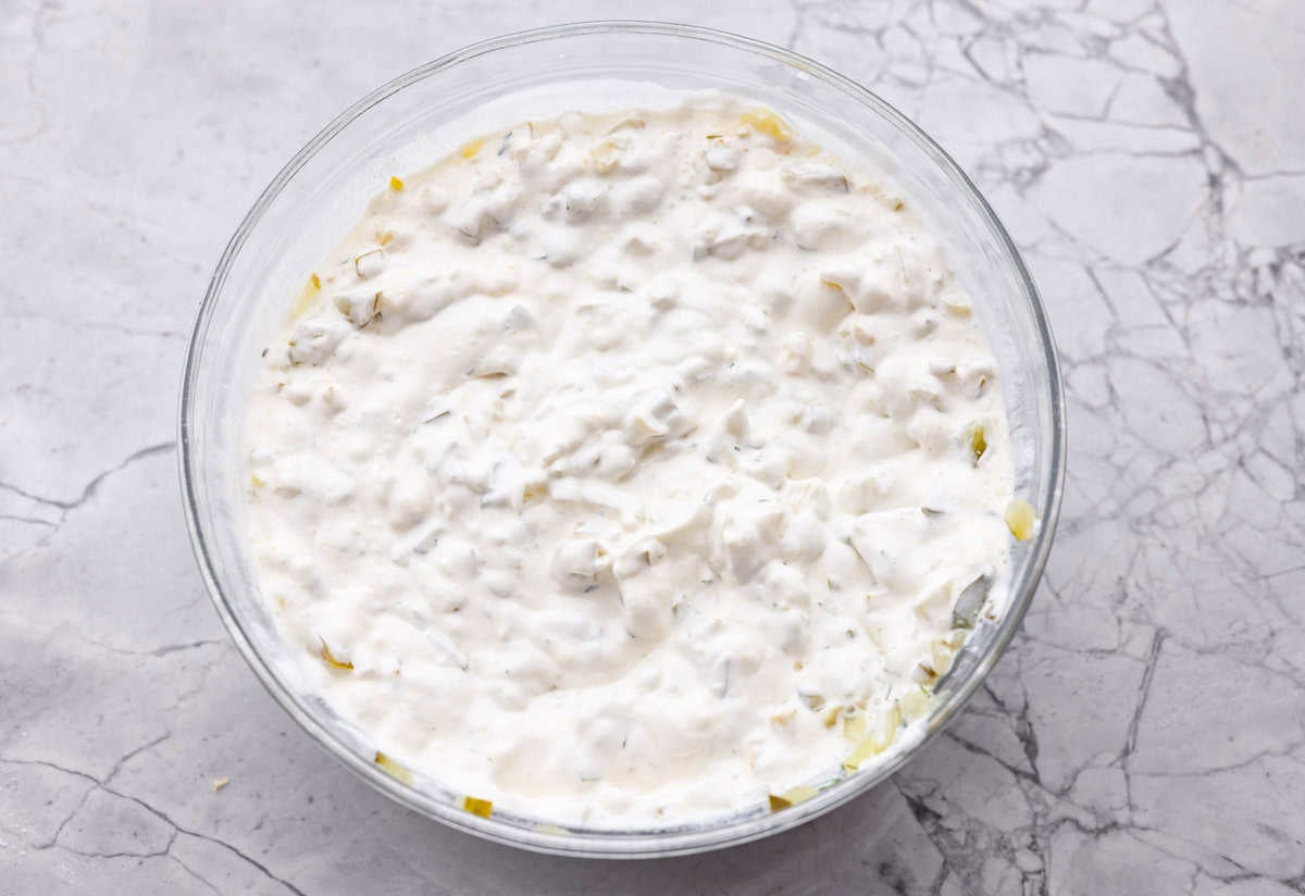Meet my Fried Pickle Dip...a viral take on my popular pickle dip! The toasted bread crumbs elevate the flavors with the crunchy Dip ingredients mixed together in a bowl.