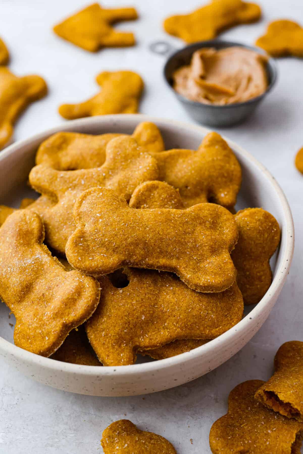 Get ready to spoil your furry friend! These homemade dog treats are made with simple ingredients and come together in no time. Your pup wonโt stop begging for more! Bowl of homemade dog treats.