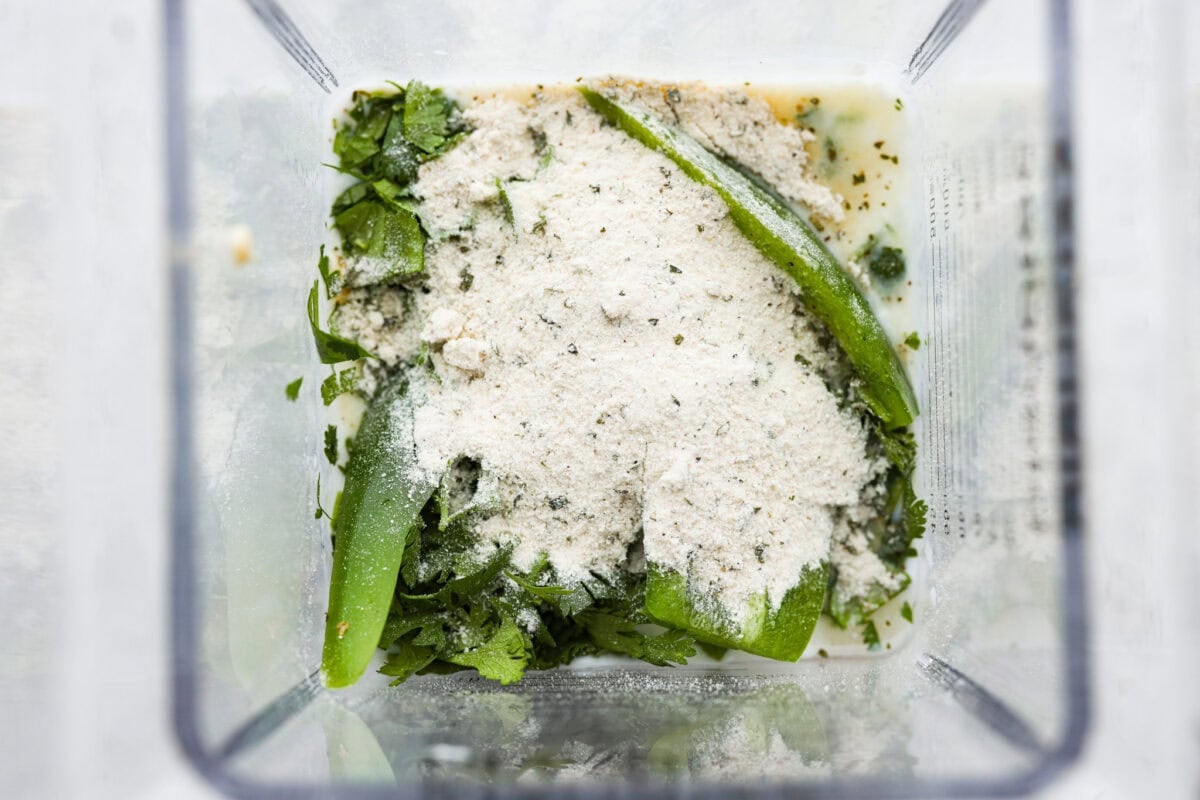 Spice meets creamy! This Jalapeño Ranch Dressing is cool, tangy, and just the right amount of zesty heat. Perfect for drizzling, dipping, or smothering on everything from salads to tacos. Jalapeno ranch dressing ingredients added to the blender.