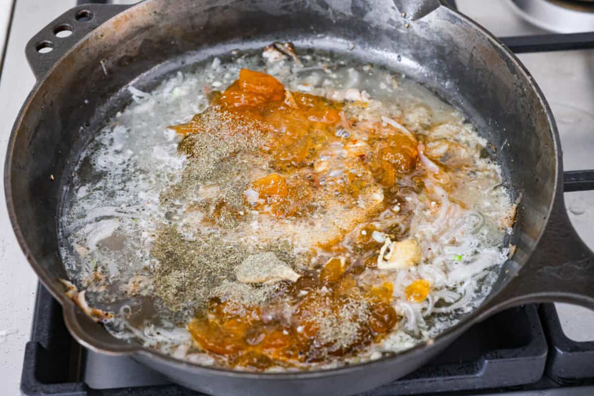 Sauce ingredients added to the skillet. 